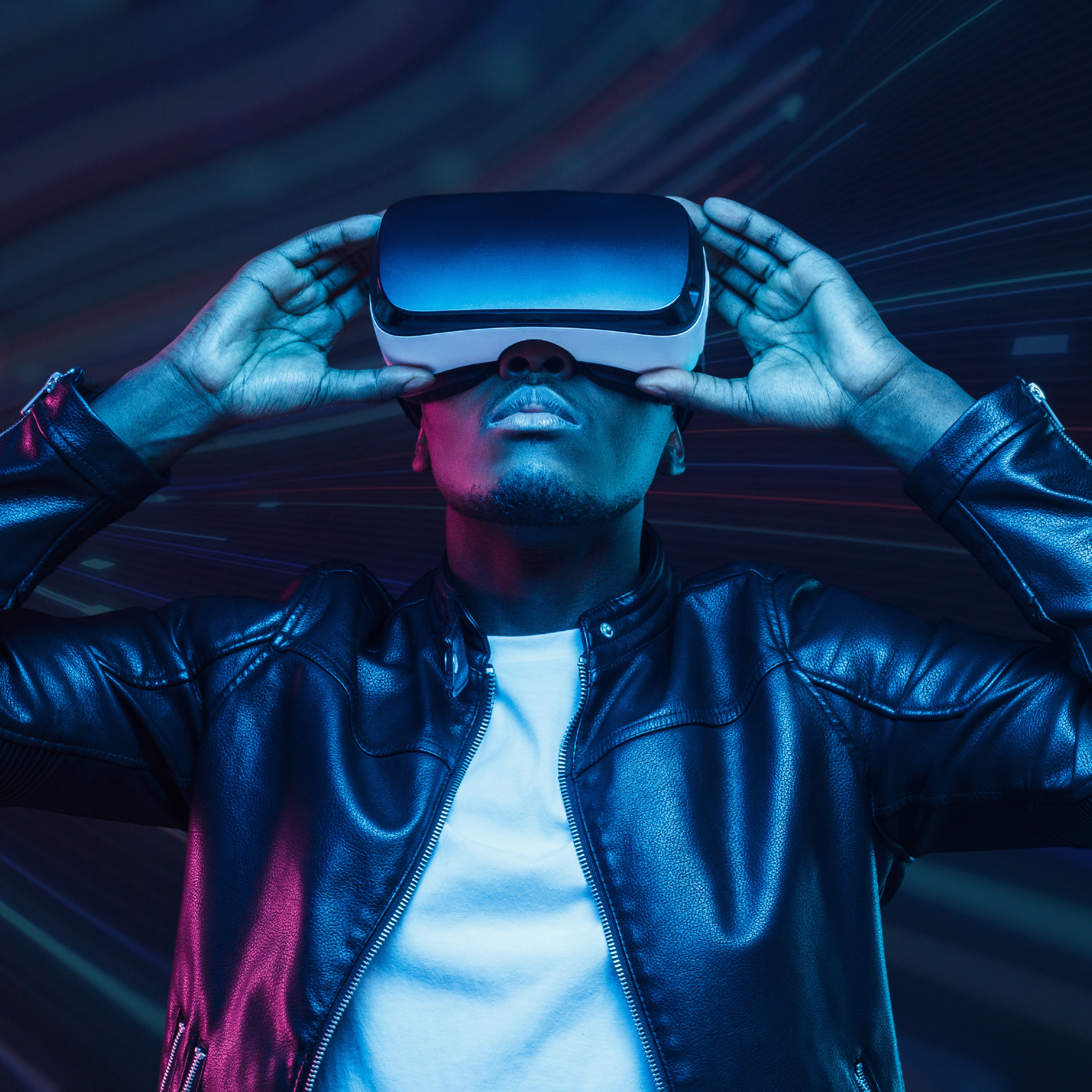 A man holds a virtual reality (VR) headset to his head