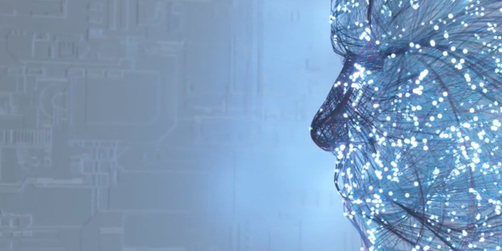 A stylised image of a face made up of neon particles and cables