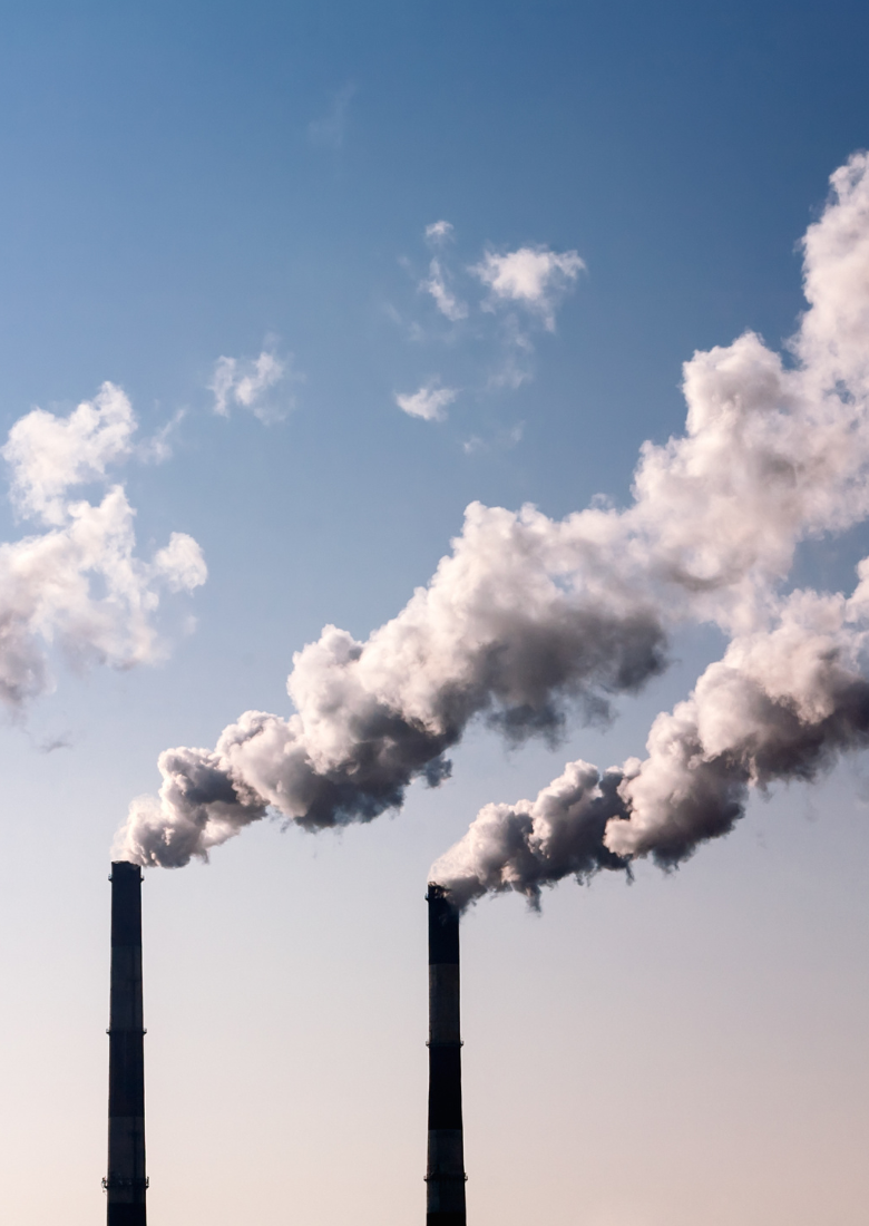 White smoke demonstrating CO2 emissions comes from two chimney stacks