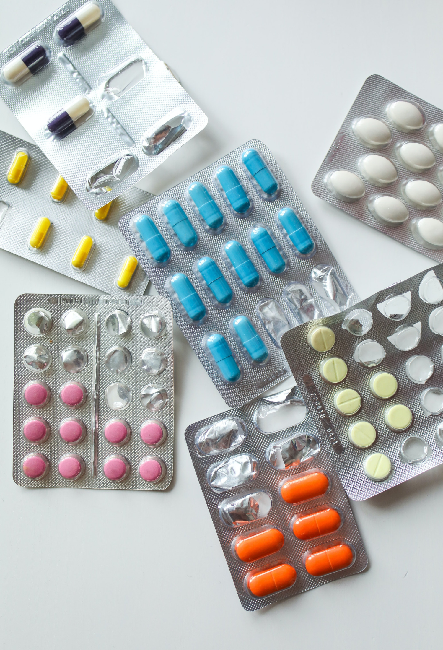 Overlaying blister packs of coloured tablets