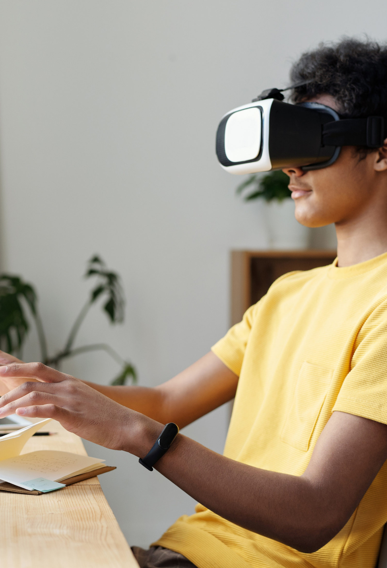 A teenager using a virtual reality headset