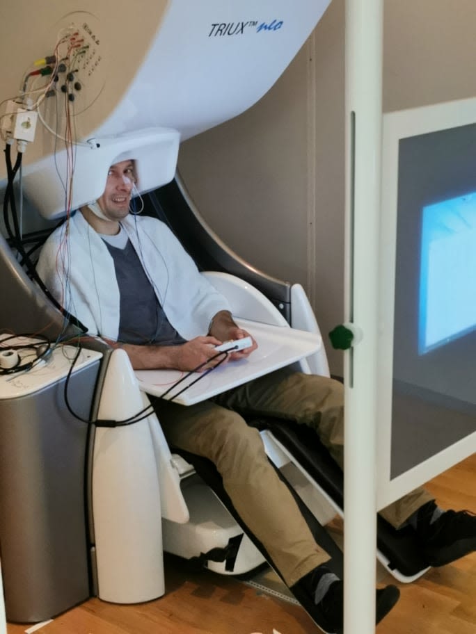 Dr Parker Jones in a magnetoencephalography (MEG) scanner