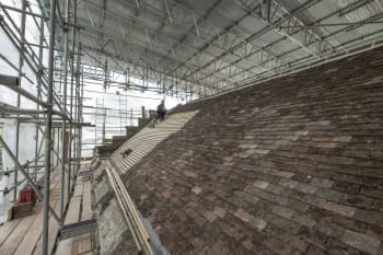 A contractor mends the roof of Little Stonham Church.