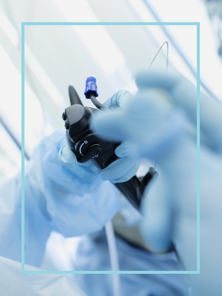 Gloved hands holding an endoscopy tube
