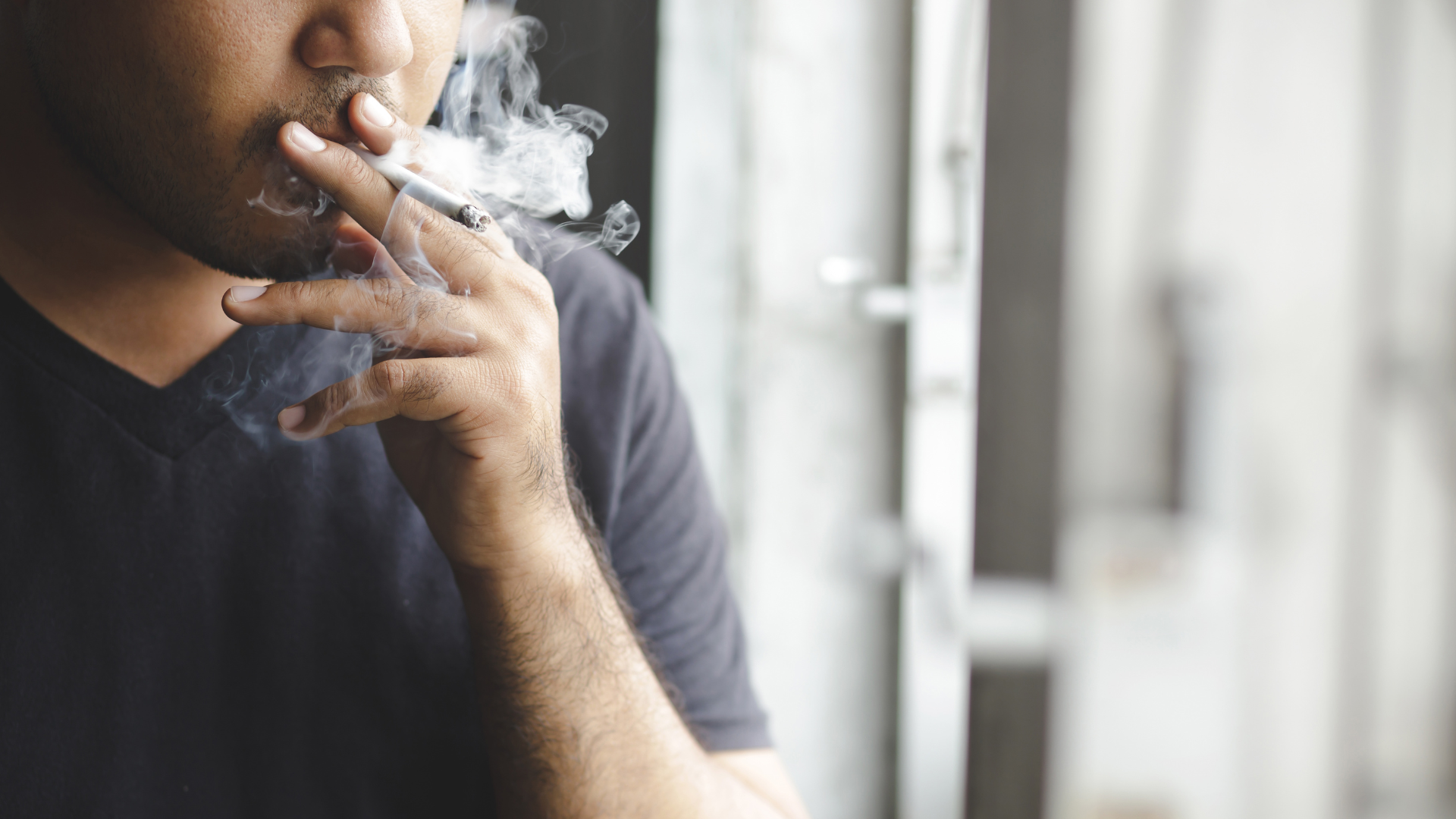 A person smoking a cigarette 