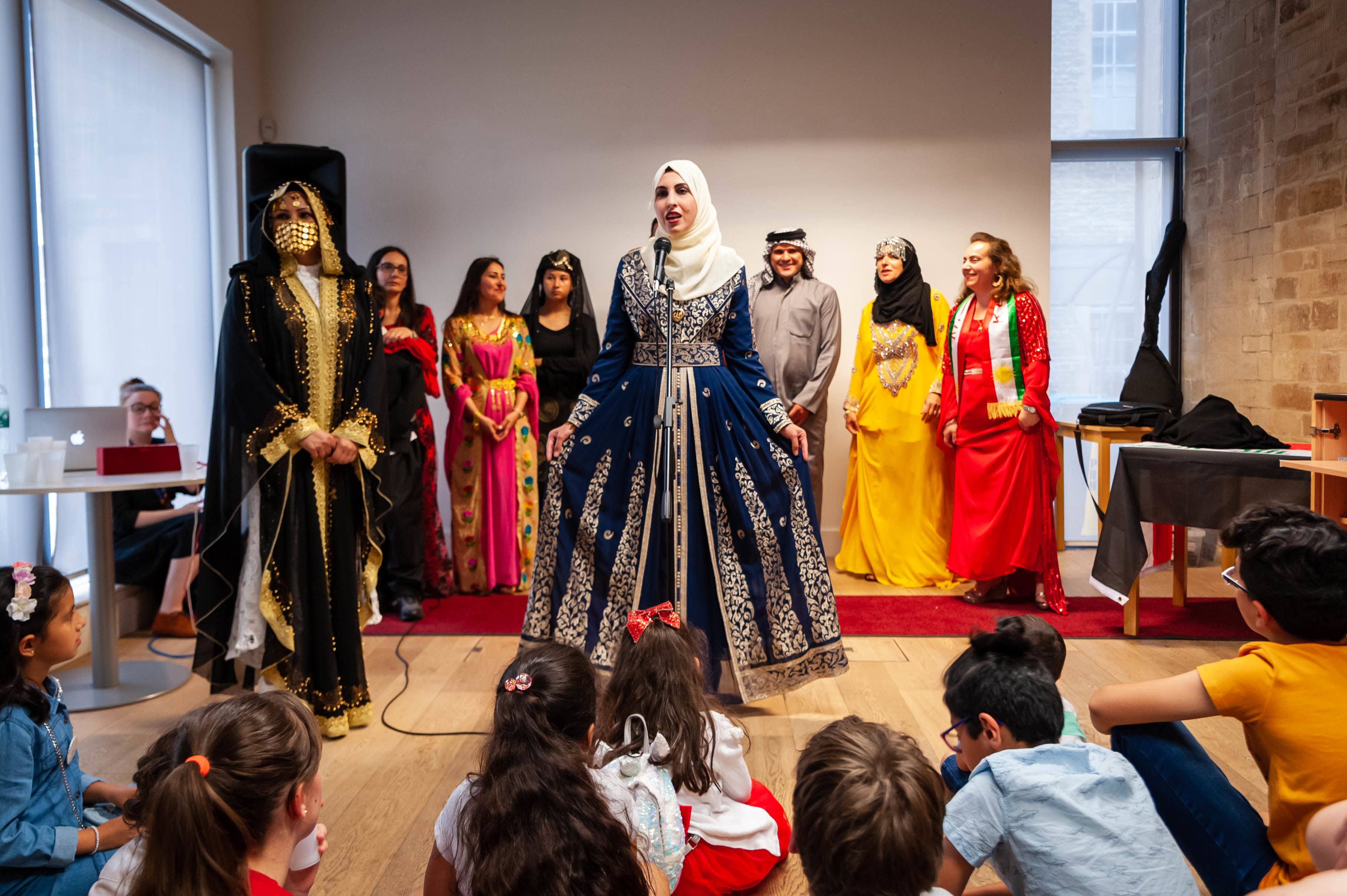 Women in traditional costume at a fashion show