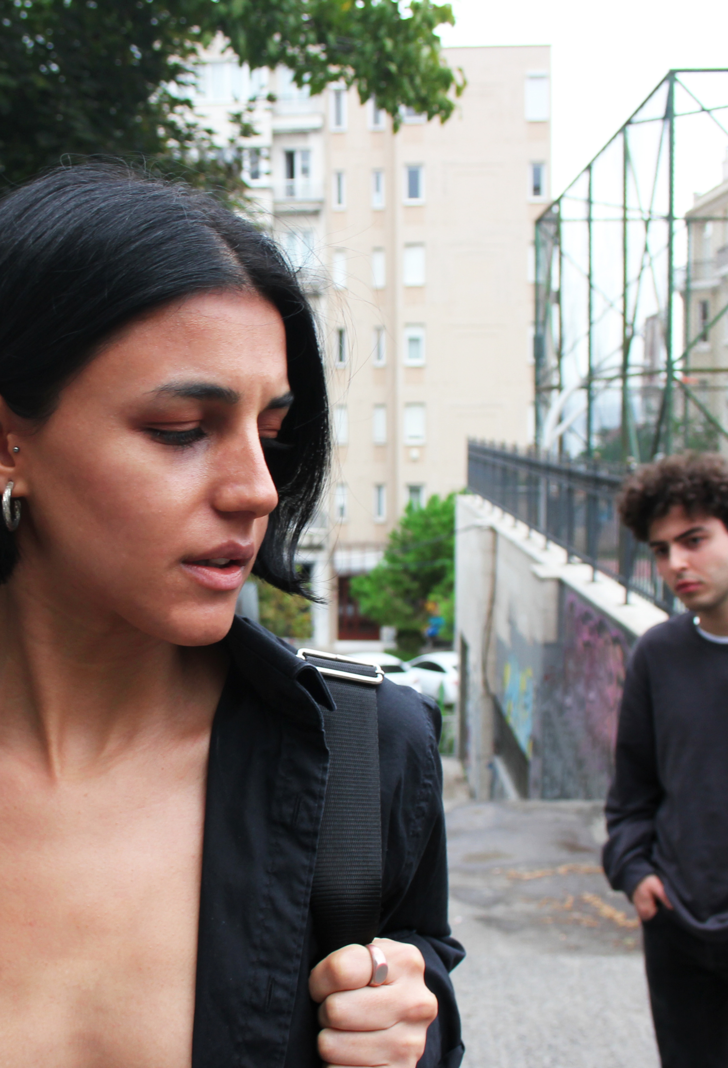 A woman being followed by a man