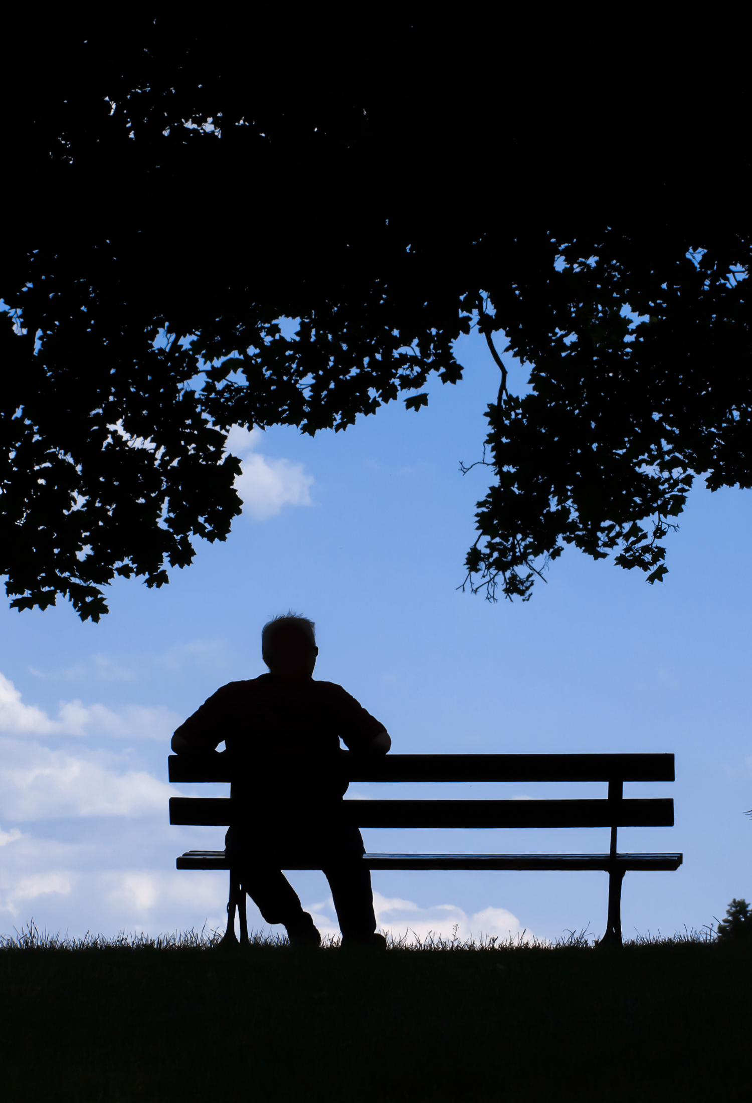 Man sitting alone on bench