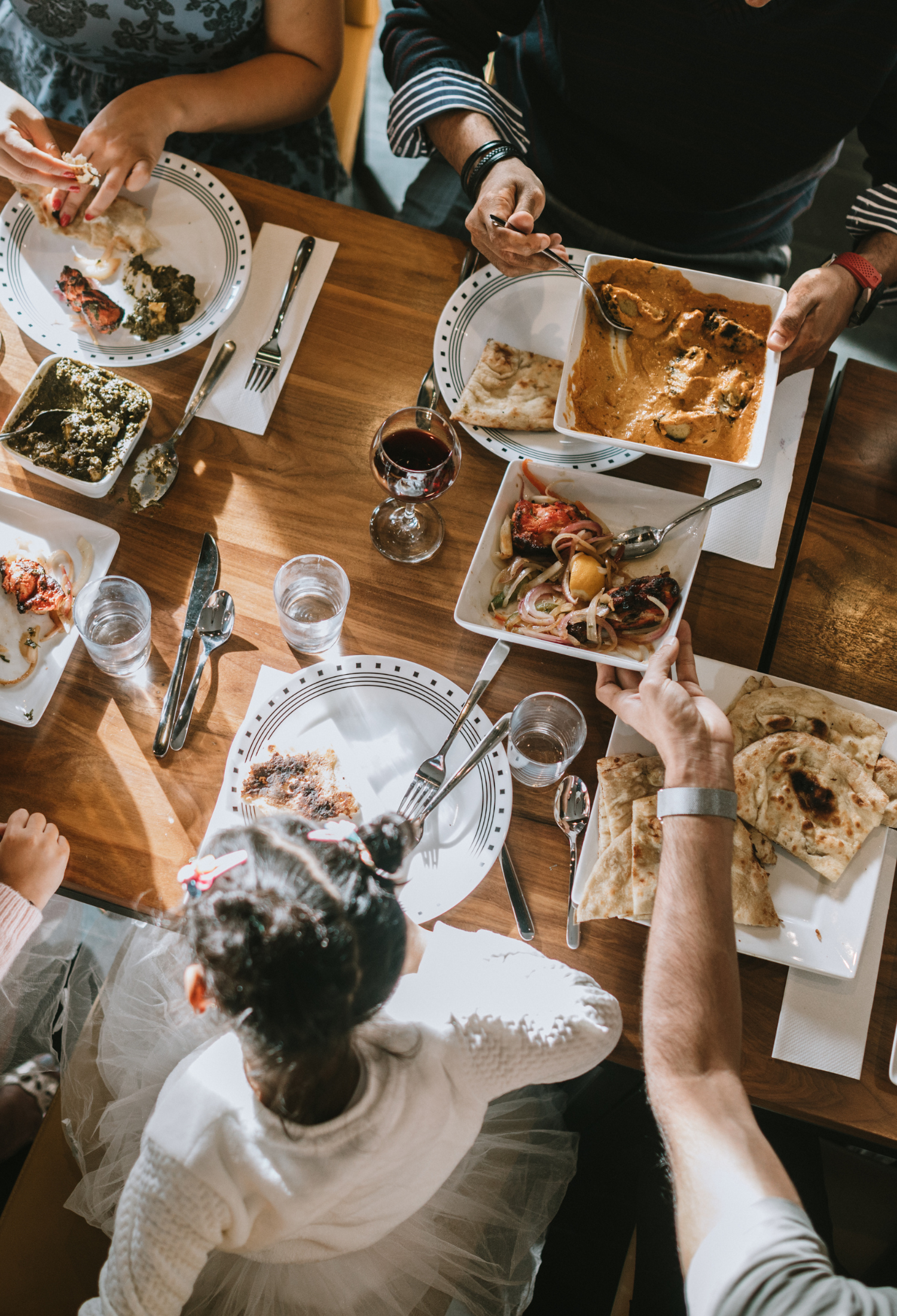 Group of people eating a meal