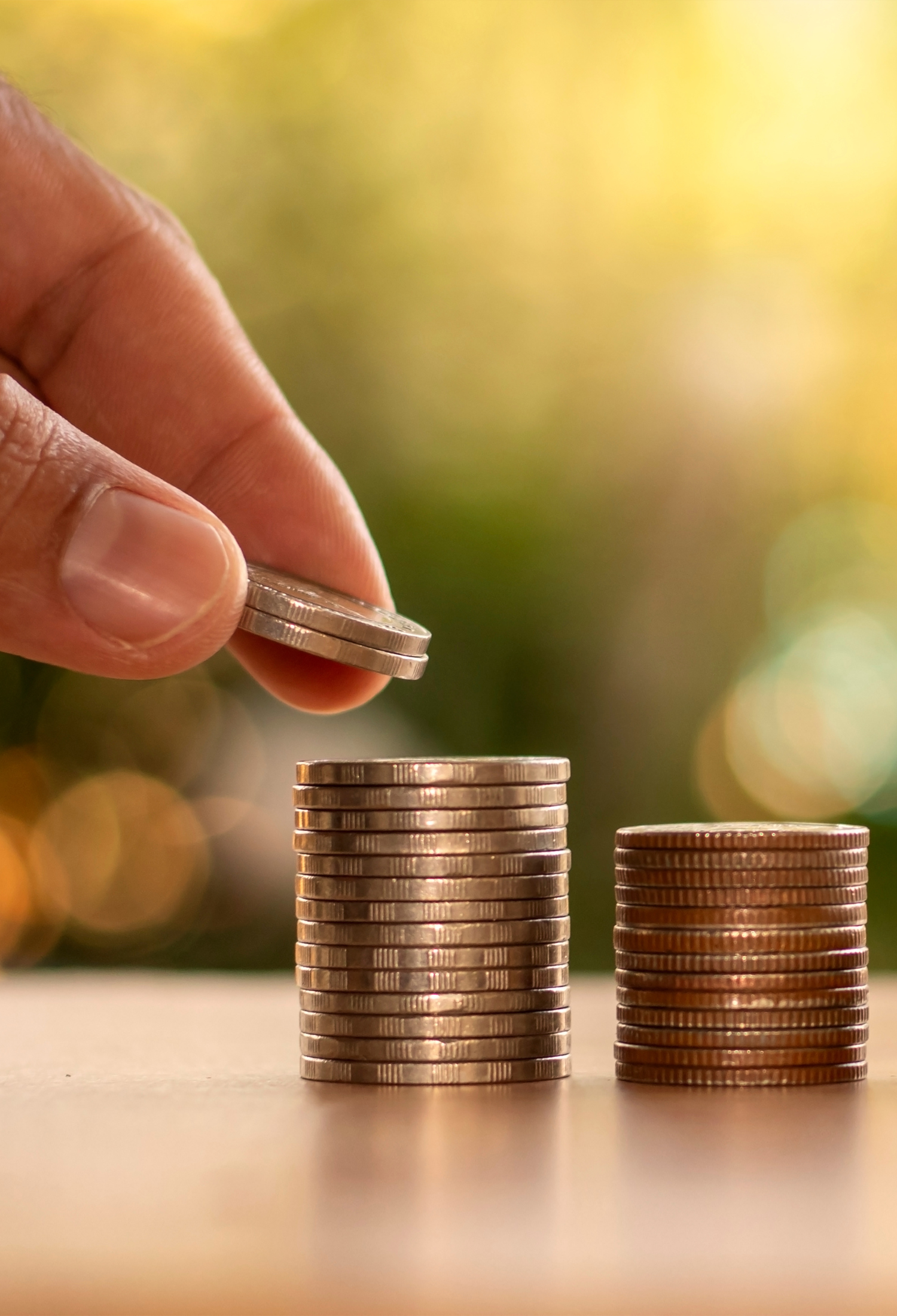 Someone stacking coins