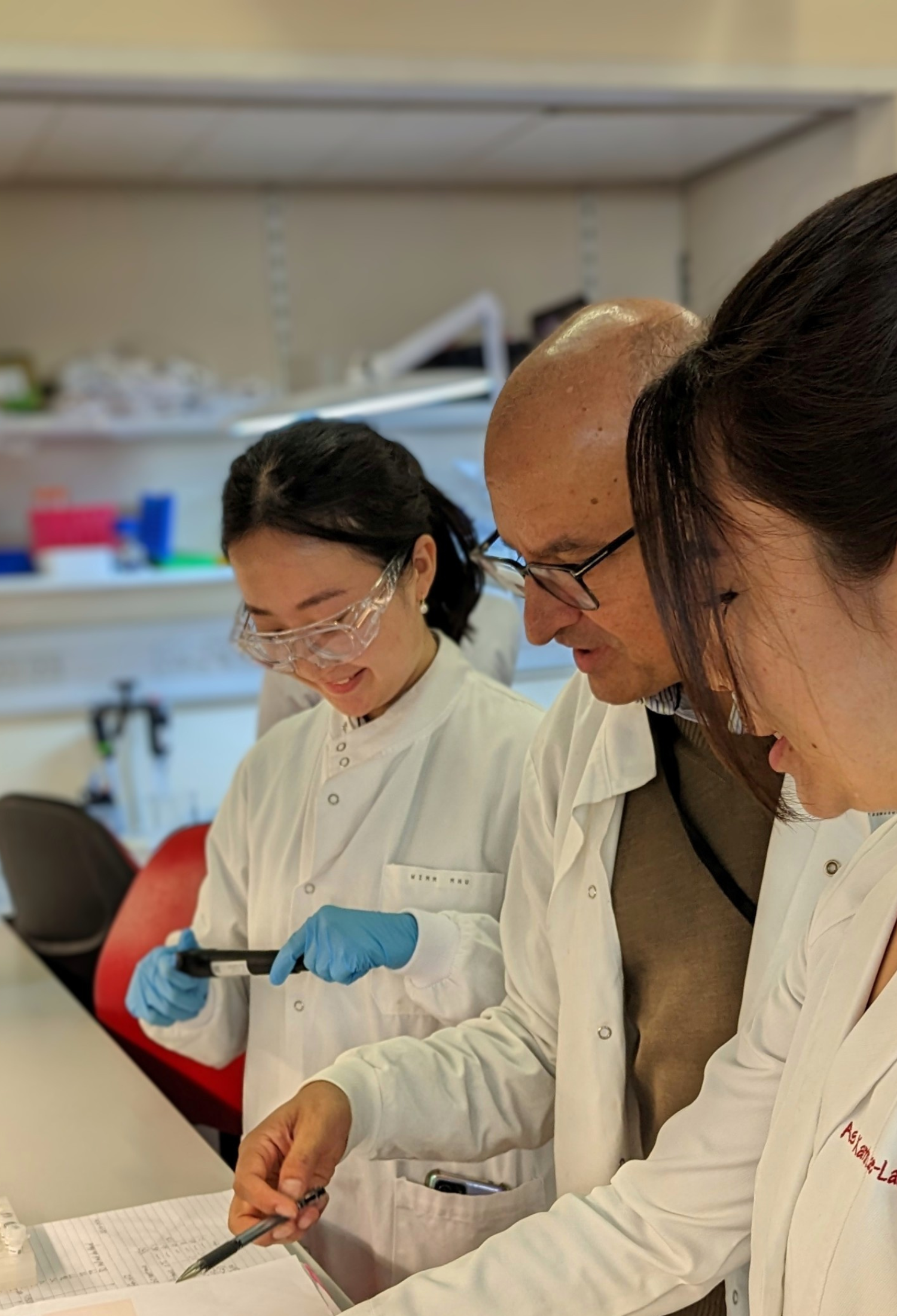 A photo of Professor KJ Patel and two researchers in his lab at the MRC Weatherall Institute of Molecular Medicine in Oxford