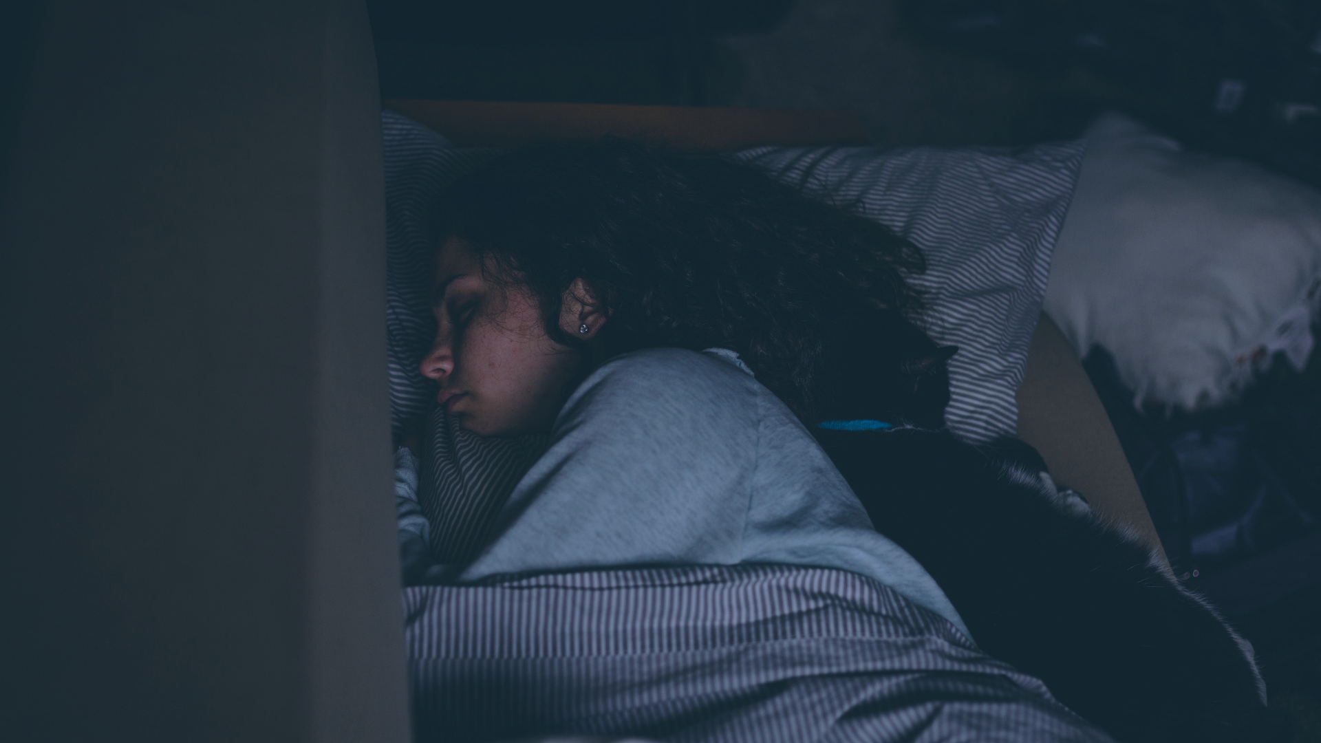 A woman lies down sleeping